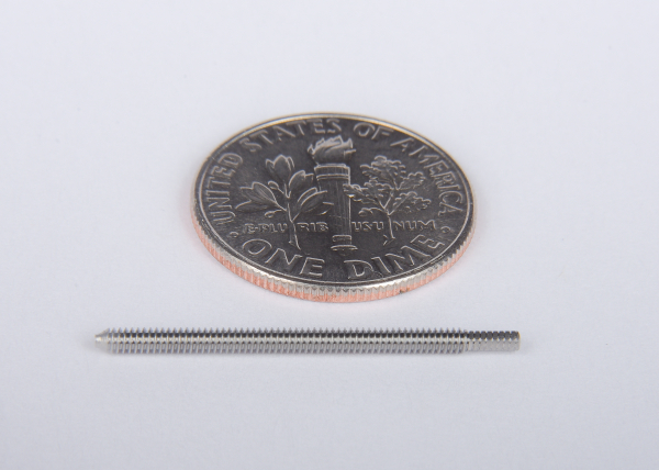 16 Pitch Nitinol Screw size compared to a dime